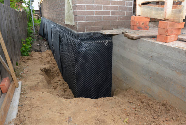 Happy homeowners after waterproofing job in Anniston